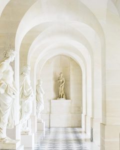 white concrete statue of a man